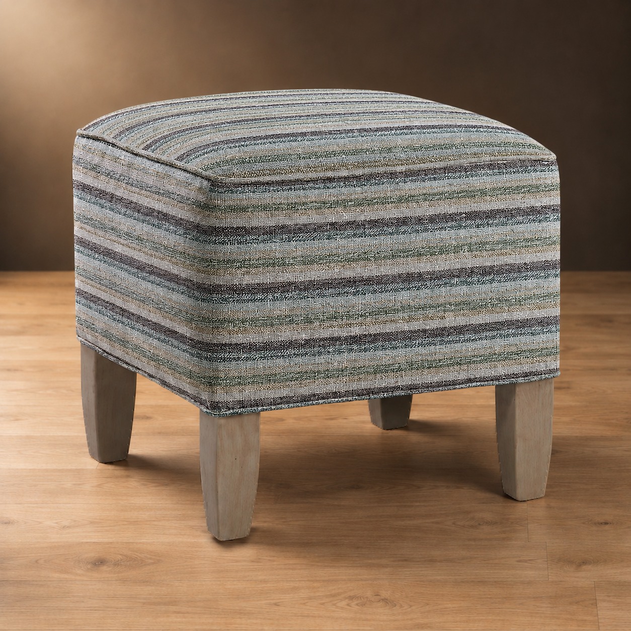 The Ashdown Ottoman in Woven Shores